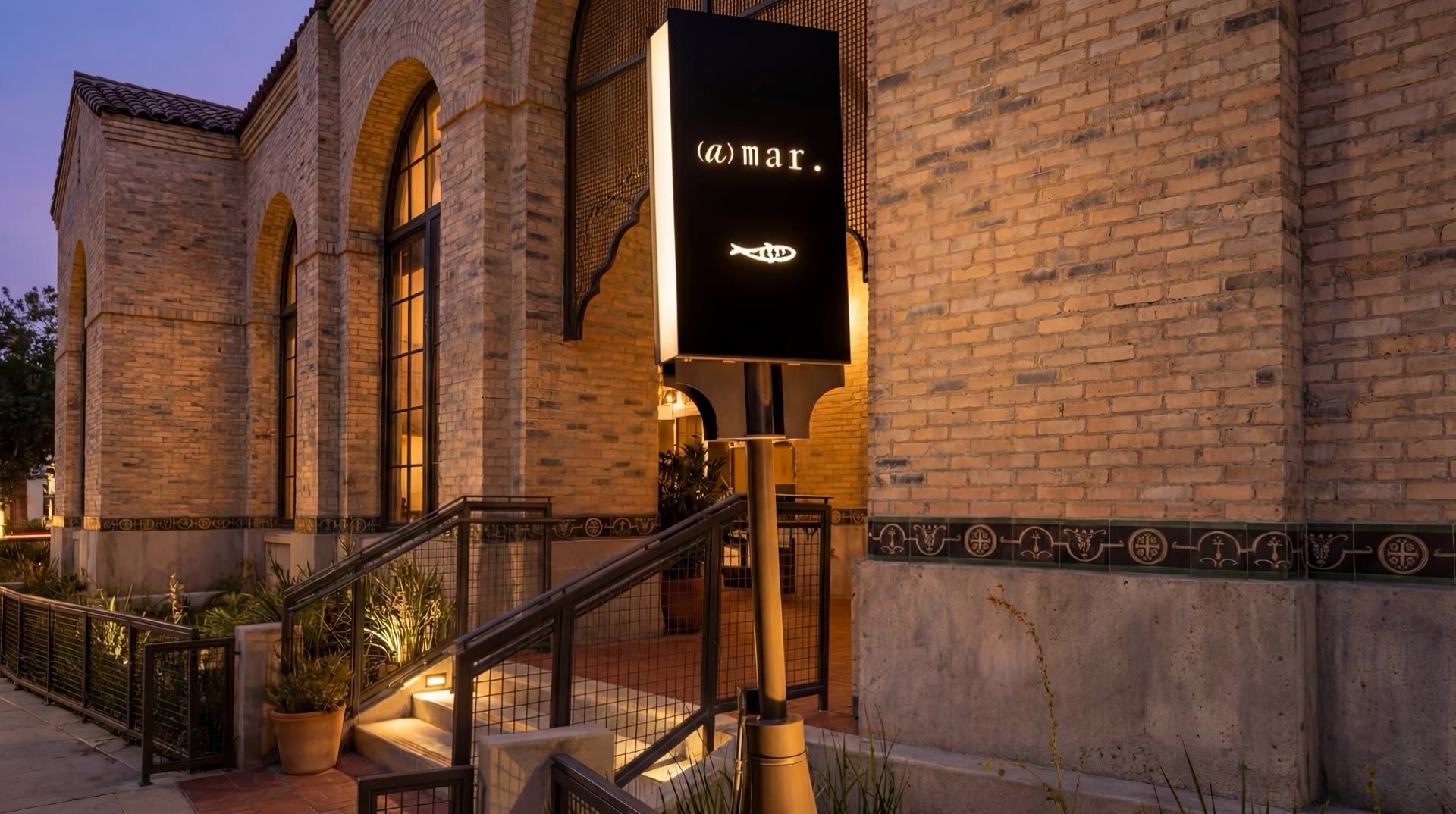 Sign outside the restaurant at dusk